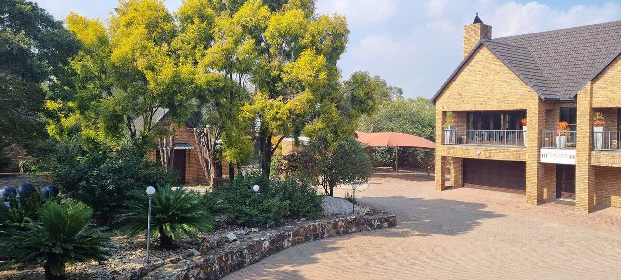 Guesthouse with yellow flowering tree